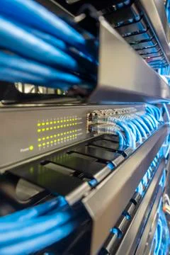 Network switch hub in rack cabinet. Network connection technology. Stock Photos
