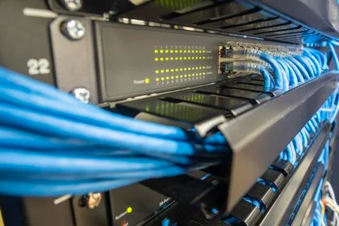 Network switch hub in rack cabinet. Network connection technology. Stock Photos