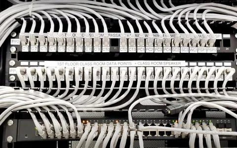 Network switch with multiple Ethernet connections inside a secure server rack Stock Photos