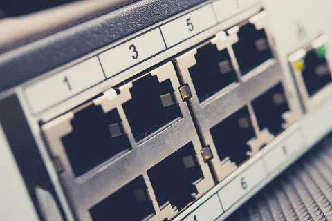 Network Switch With Multiple Ports for Wired Connections in a Modern Setting Stock Photos