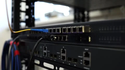 Network technician connecting ethernet cable to switch Stock Footage 278149965