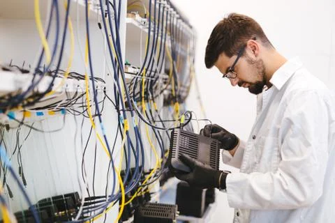 Network technician testing modems Stock Photos
