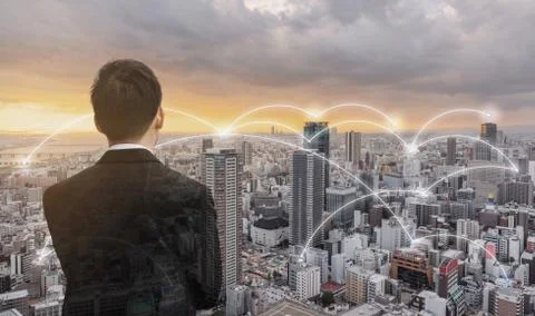 Network technology, logistics and blockchain business. Businessman looking city Stock Photos