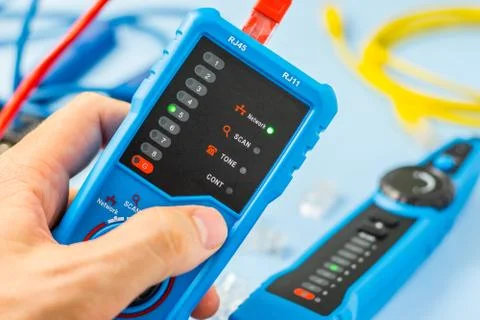 Network tester in the engineer's hand Stock Photos