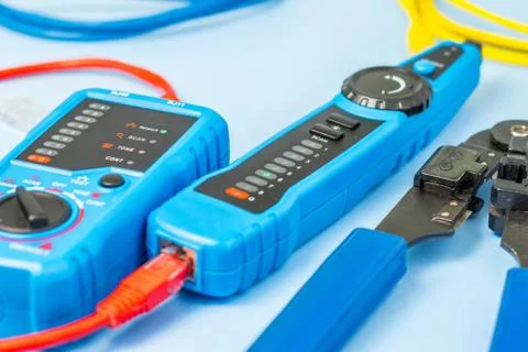 Network tester, patching cord, and network tool are blurred Stock Photos