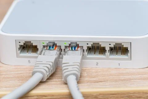 Network wires connected to the switch, router close up Stock Photos