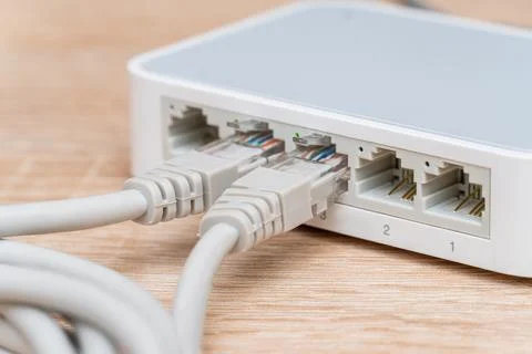 Network wires connected to the switch, router close up Stock Photos