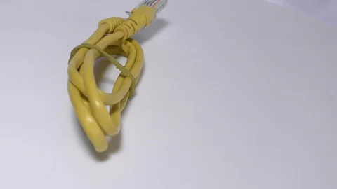 A networking cable with rj45 on white surface and moving Stock Footage 111887721