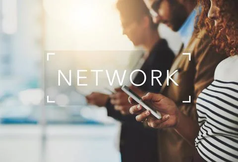 Networking is defined as a function of business. a businesspeople using their Stock Photos