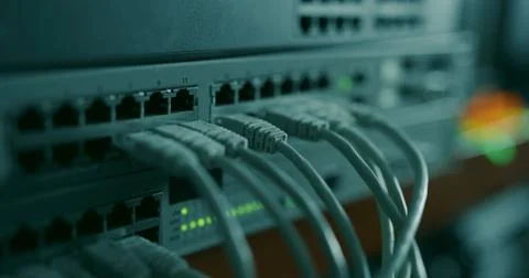 Networking hardware with attached RJ45 ethernet cables Stock Photos