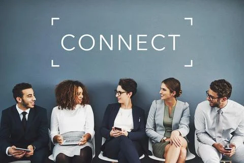 Networking before their interview. Studio shot of businesspeople talking whil Stock Photos