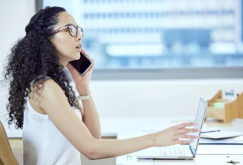 Networking through everything form of technology. a young businesswoman on a Stock Photos