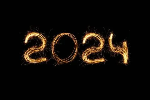 Neues Jahr 2024 light. Sparklers zeichnet Zahlen 2024. Bengalische Lichter... Stock Photos