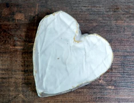 The Neufchatel cheese on wooden table Stock Photos