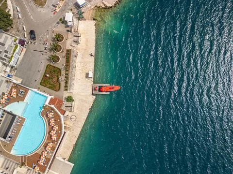 Neum Top Down Drone Photo with Red Boat, Adriatic Sea, Pool, and Neumski Topovi Stock Photos