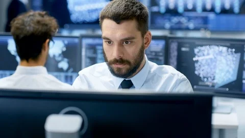 Neural Network and Machine Learning Engineer Programming at His Workstation.  動画素材 81268572
