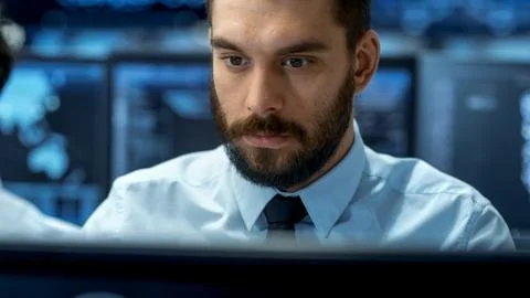 Neural Network and Machine Learning Engineer Working Hard at His Workstation. Stockfoto's
