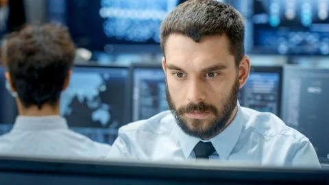 Neural Network and Machine Learning Engineer Programming at His Workstation.  Stock Photos