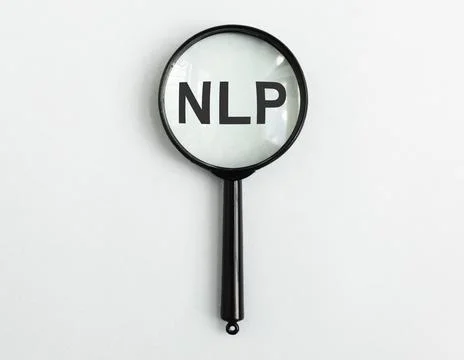 Neuro-linguistic programming, NLP acronym through magnifying glass lens, ma.. Stockfoto's