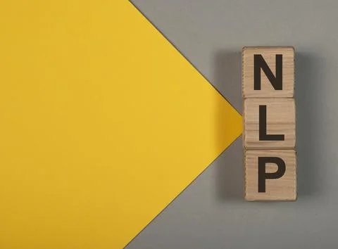 Neuro-linguistic programming, NLP acronym on wood cubes on yellow backgroun.. 写真素材