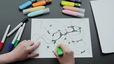 Neurographics close-up top view. a female hand paints a drawing with black Stock Footage 194558700