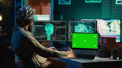 Neuroscientist uploads brain into cyberspace using green screen laptop Stock Footage 266950103