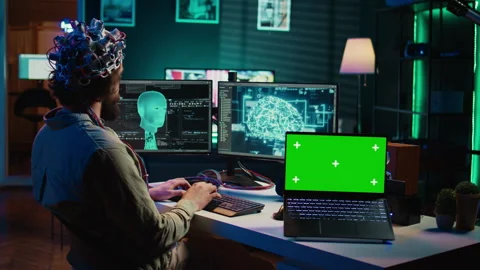 Neuroscientist uploads brain into cyberspace using green screen laptop Stock Footage 266953919