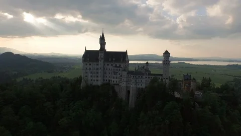 Neuschwanstein Castle surrounded with green trees Stock Footage 116187732