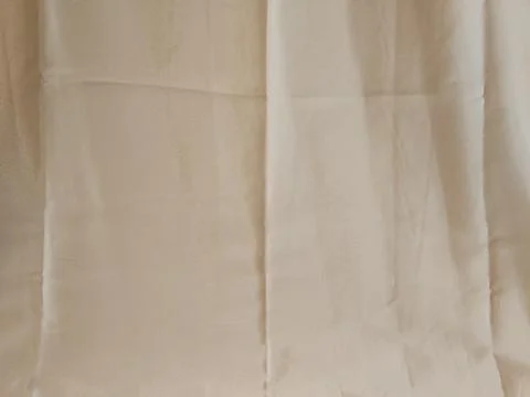 Neutral Beige Fabric Texture Background with Soft Natural Lighting 库存照片