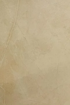 Neutral beige stone surface with subtle texture and natural patterns ideal for Stock Photos