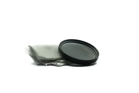 Neutral Density (ND) camera lens filter with cleaning cloth Stock Photos