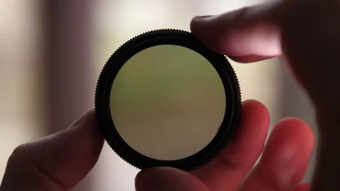 Neutral Density variable ND Filter. Videographer holding and turning with hands Stock Footage 119170656