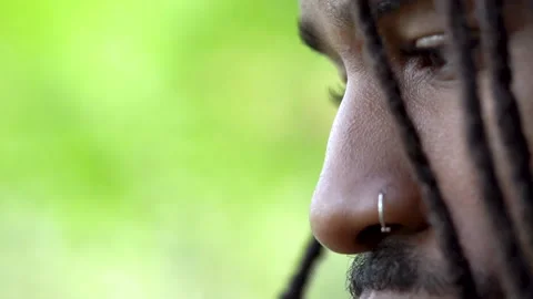 Neutral Expression Young African American Man in Nature Setting Face Close Up Stock Footage 142012308