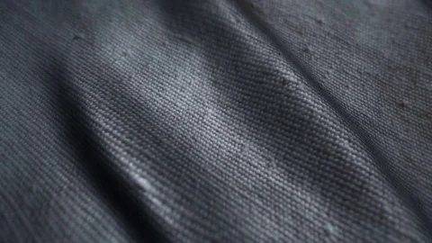 Neutral gray fabric background waving in the wind. Easy to colorize to any color Stock Footage 77849441