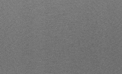 Neutral gray grainy texture background with fine noise pattern. Minimal matte Stock Photos