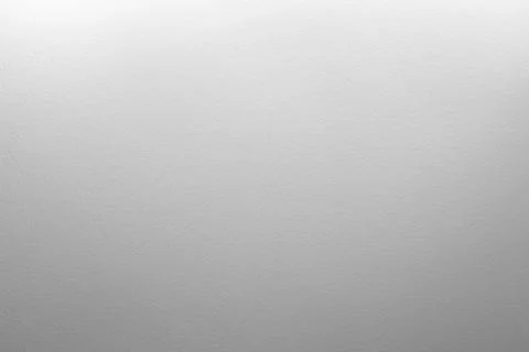 Neutral gray textured wall with a subtle top-to-bottom gradient Stock Photos