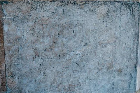 Neutral grayish-blue plaster surface with light marbling and aged texture effect Stock Photos
