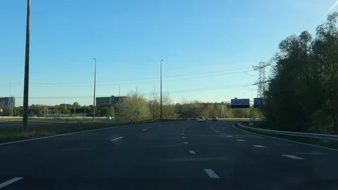 Neutral roadside highway with first-person perspective showing road signs Stock Footage 342753586