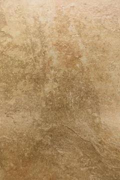 Neutral textured surface displays subtle patterns in warm beige tones, perfect Stockfoto's