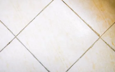 Neutral white bathroom tile pattern with subtle cream decorative texture. Stockfoto's