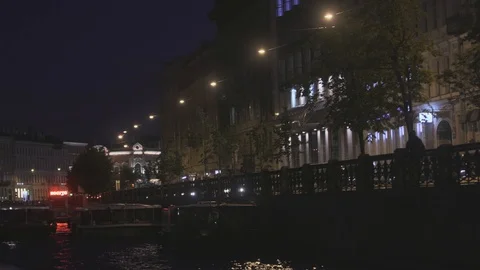 A Neva river surrounded by buildings of St. Petersburg at night Stock Footage 120152367