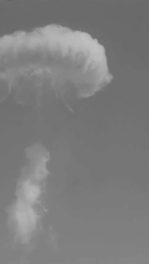 NEVADA - 1952 - Close-up and distant views of the mushroom cloud left by an Stock Footage 340326844