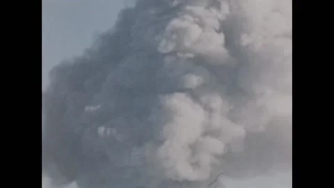 NEVADA - 1955 - Tilt up an atomic bomb mushroom cloud. Stock Footage 308176352
