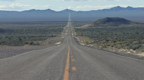 Nevada Desert Highway Reverse Zoom SR375 Stock Footage 10982662