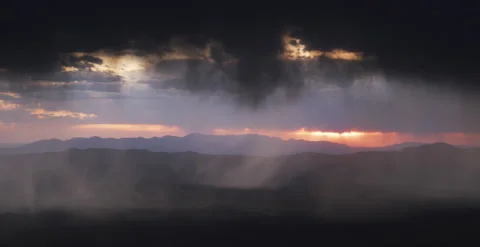 Nevada - Sunset Through Rain Falling Over Mountains - 6K Realtime Stock Footage 144032940