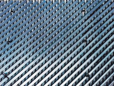 Never ending view of solar panels stacked in lines on the rooftop Stock Photos