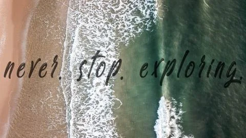Never stop exploring quote on the beautiful sea and beach of vietnam, drone shot Stock Photos
