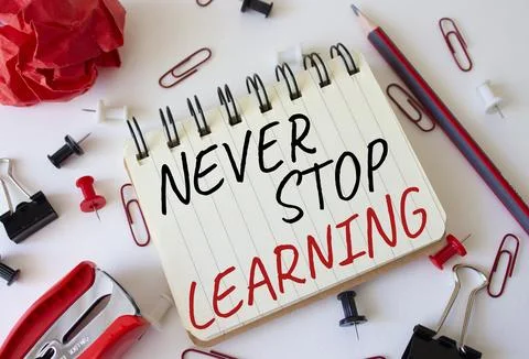 Never stop learning symbol. Concept words Never stop learning on white note.. Stock Photos
