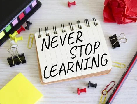 Never stop learning symbol. Concept words Never stop learning on wooden not.. Foto stock