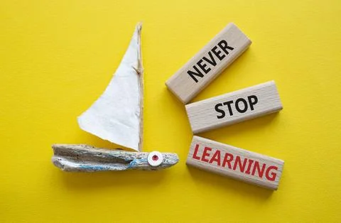 Never stop Learning symbol. Concept words Never stop Learning on wooden blo.. Stock Photos